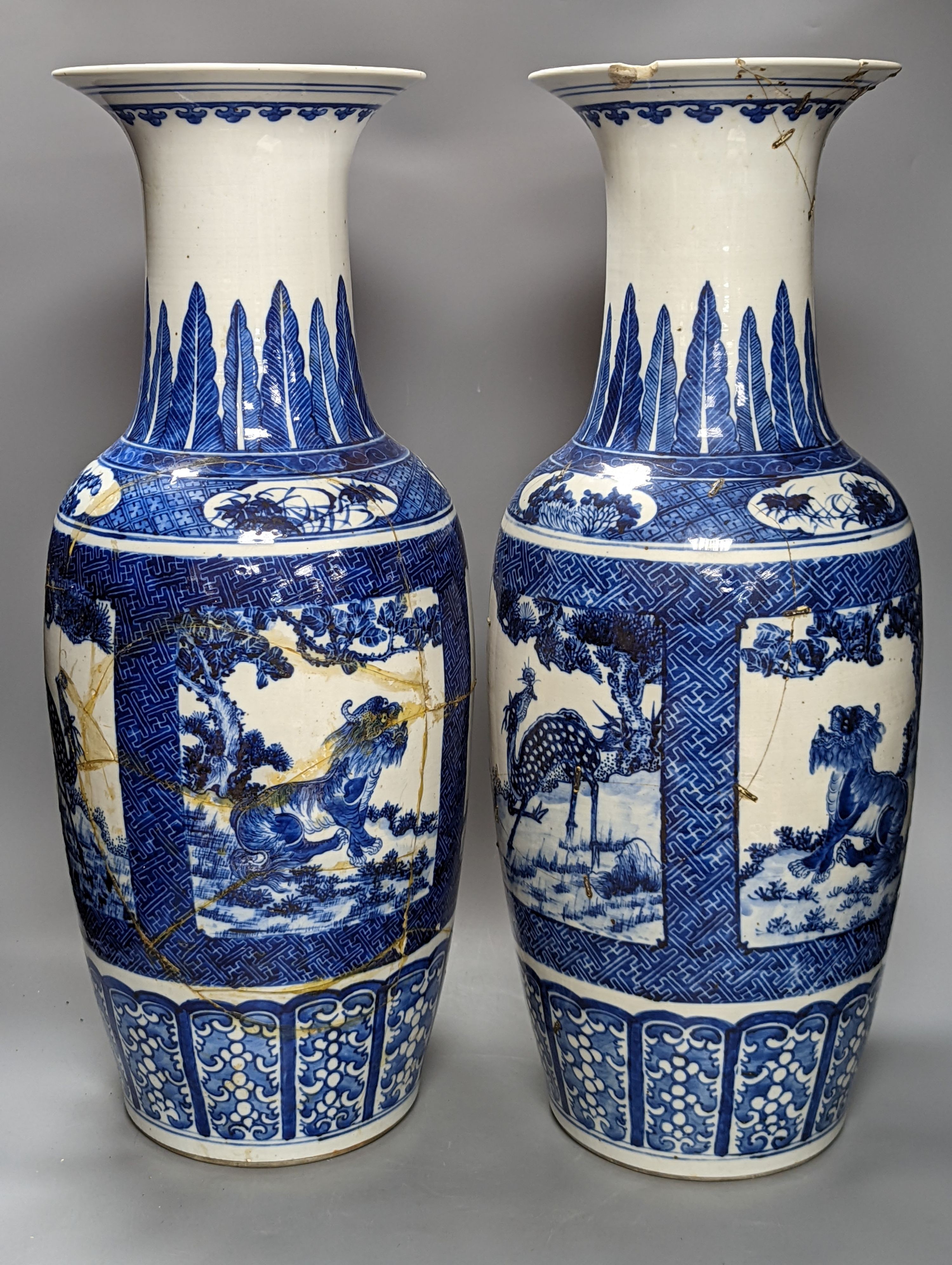 A pair of large early 20th century Chinese Blue and white ‘mythical beast’ vases, 60 cms high.